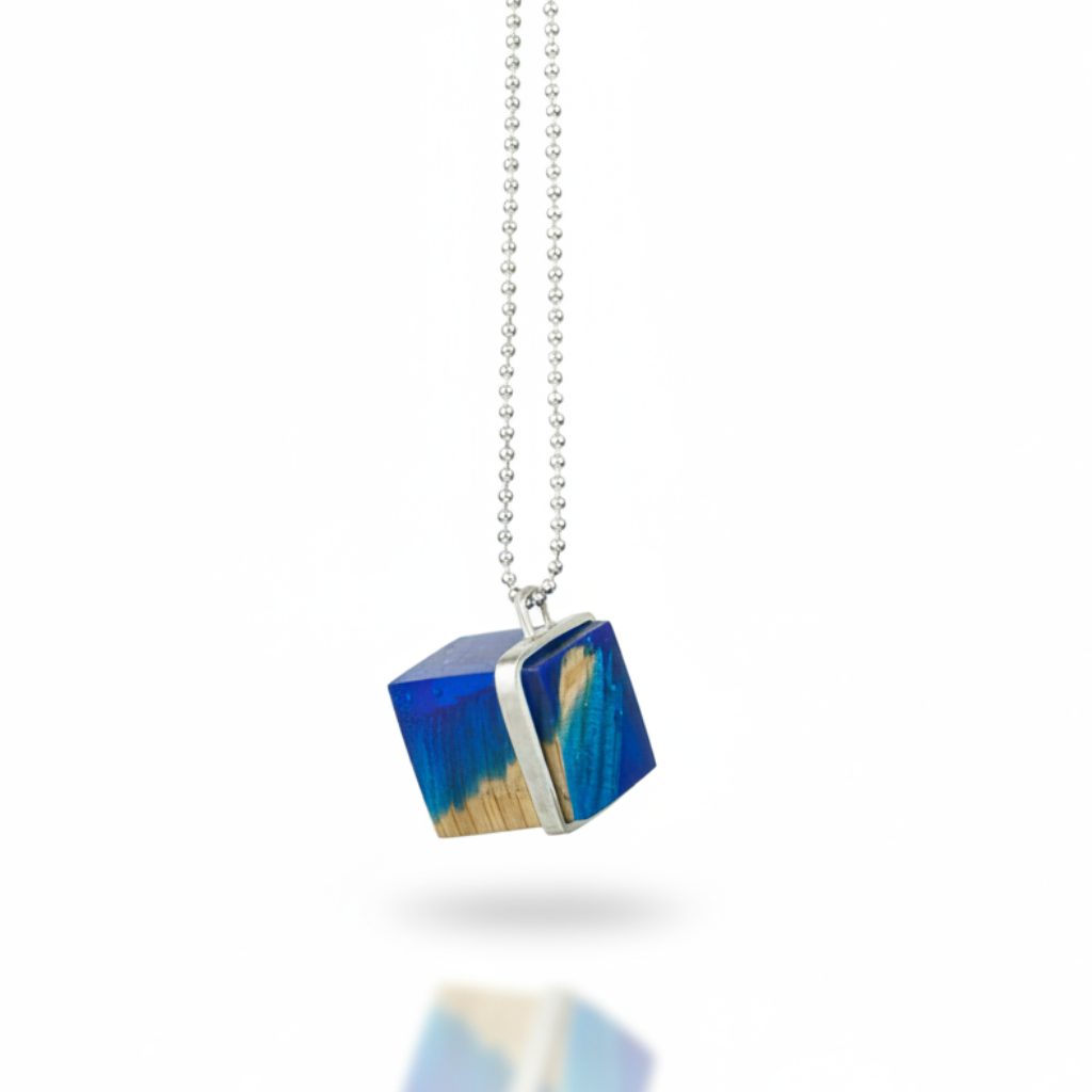 Blue cube pendant with shadow reflection